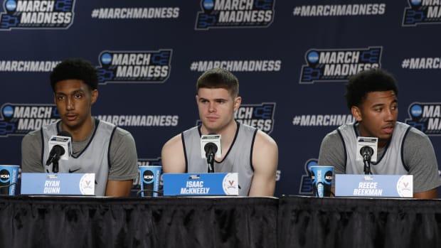 Mar 18, 2024; Dayton, OH, USA; Virginia Cavaliers guard Ryan Dunn (13) guard Isaac McKneely (11) and guard Reece Beekman (2) talks to the media during NCAA Tournament First Four Practice at UD Arena. 